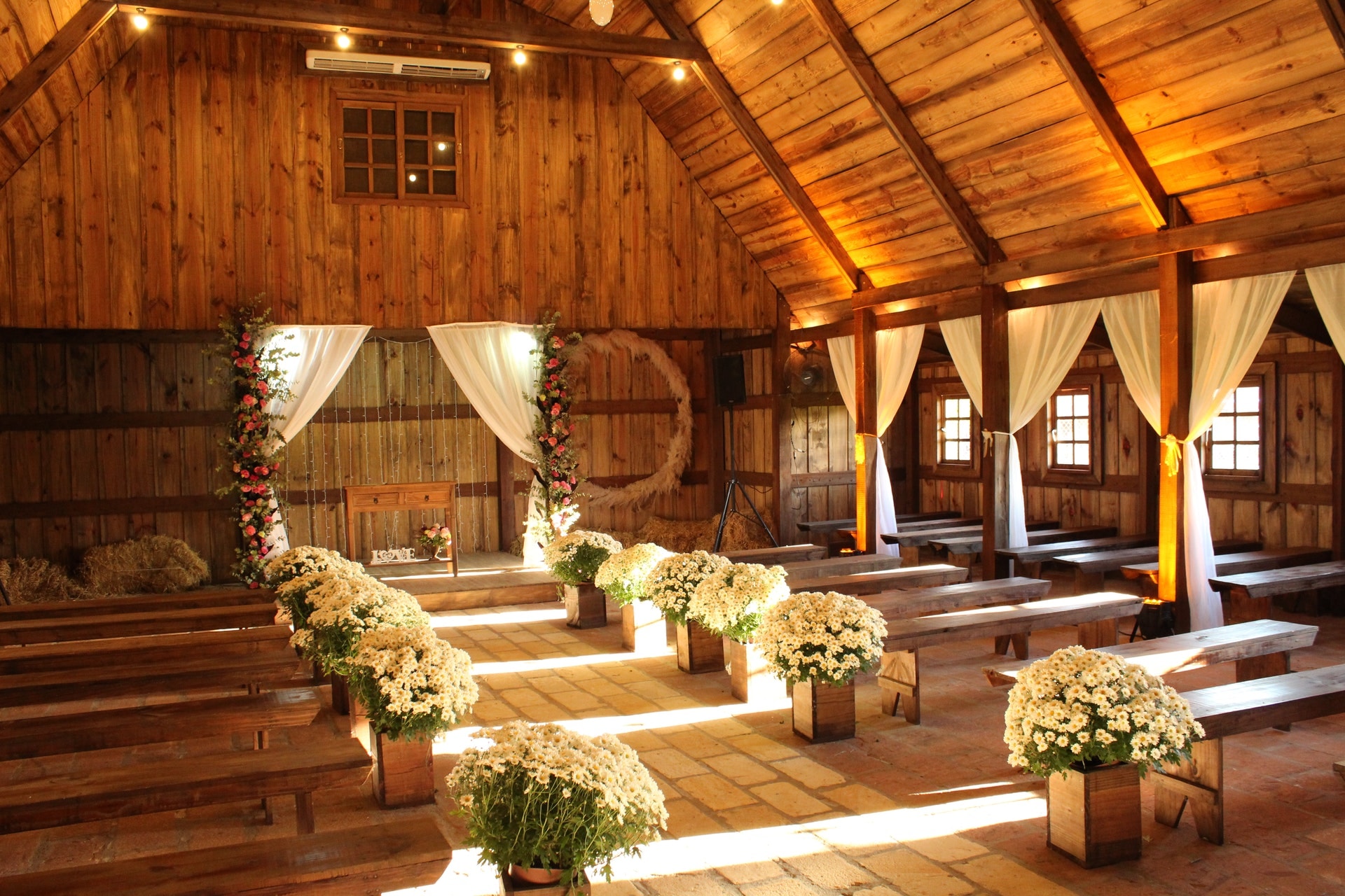 Barn drapes with floral arch