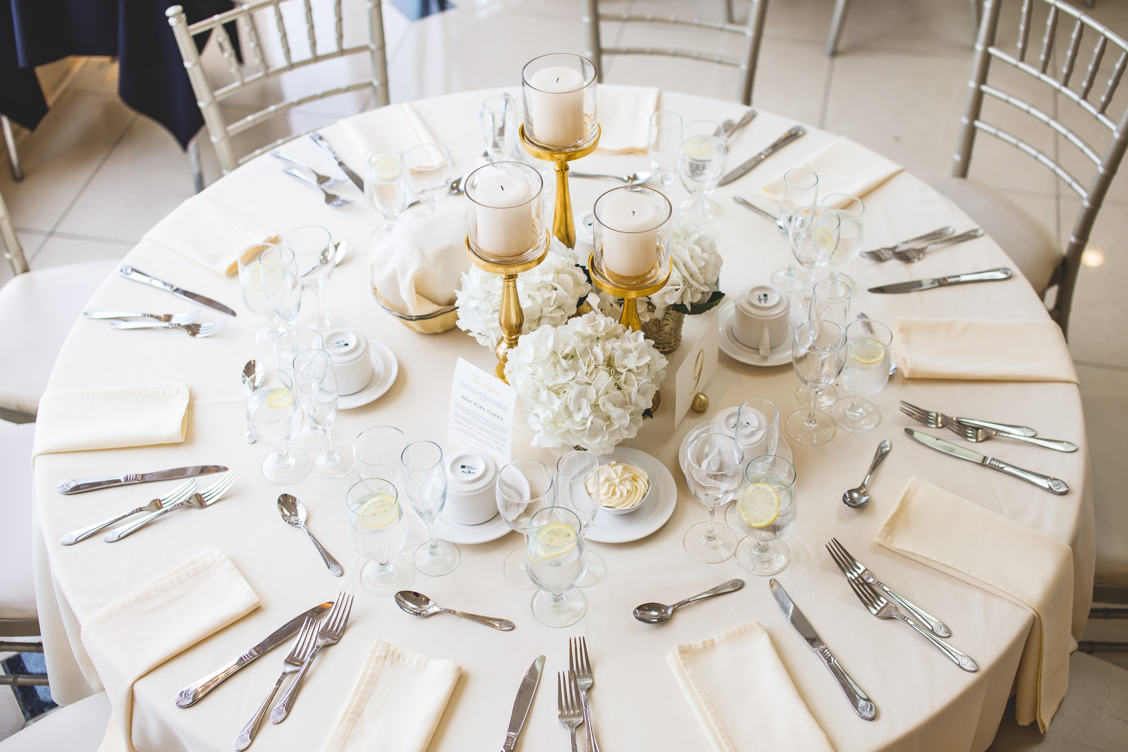 Rustic farmhouse table with gold flatware