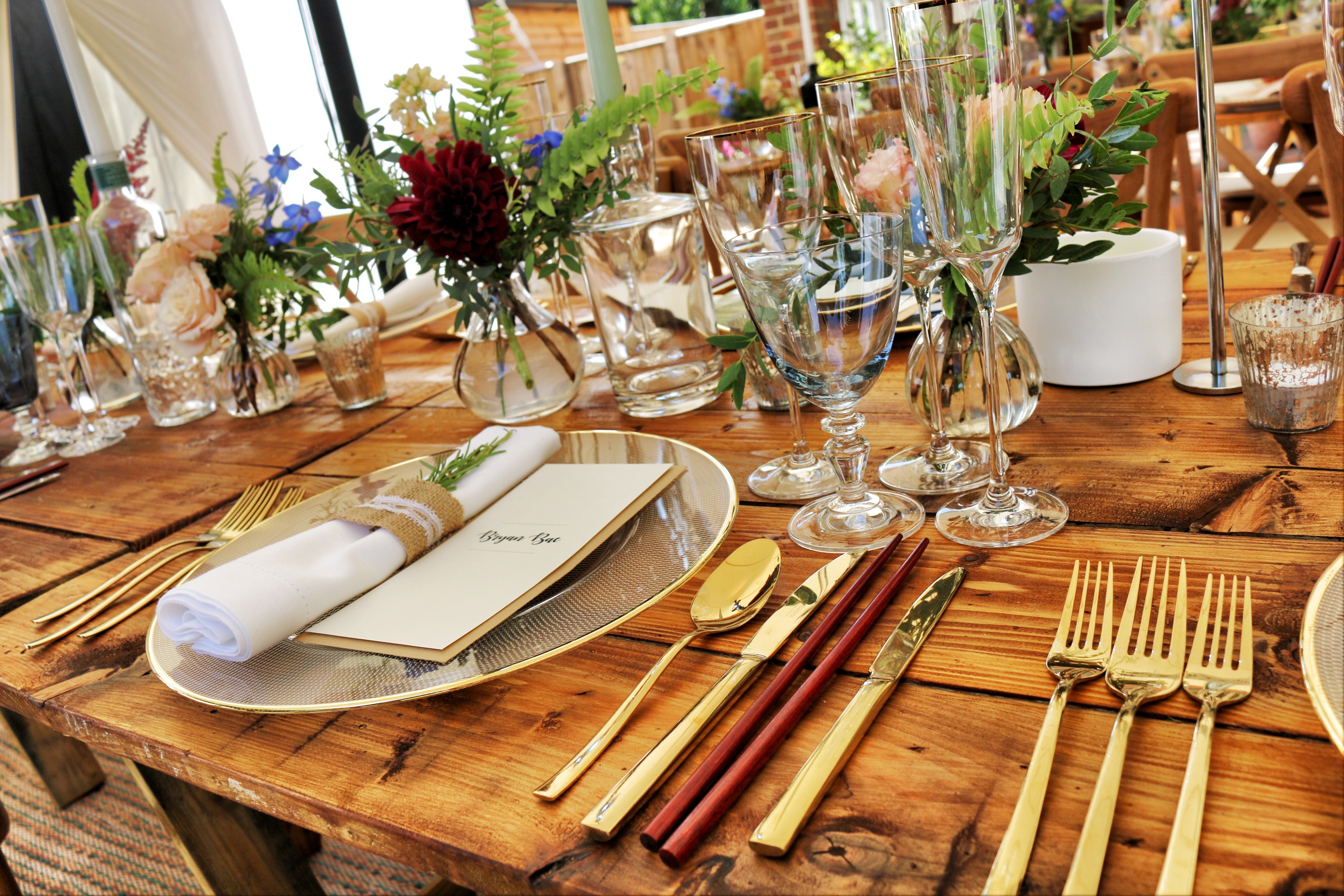 Round table with white hydrangeas and gold candles